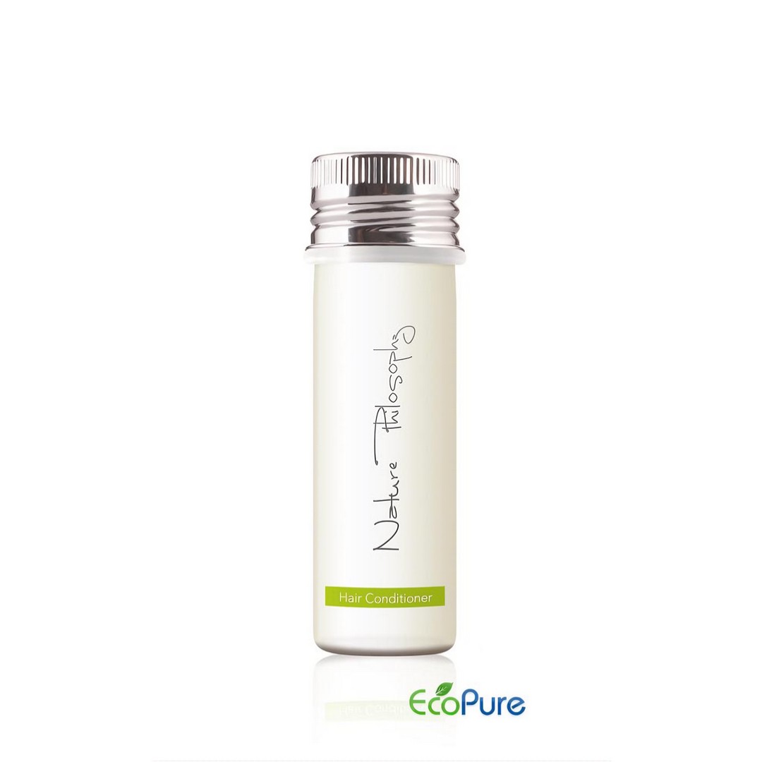 Hotel hair conditioner in a sleek white bottle 40ml with a silver cap, formulated with green tea, and Eco pure. A premium part of the Nature Philosophy hotel toiletries collection, natural and indulgent hotel amenities.