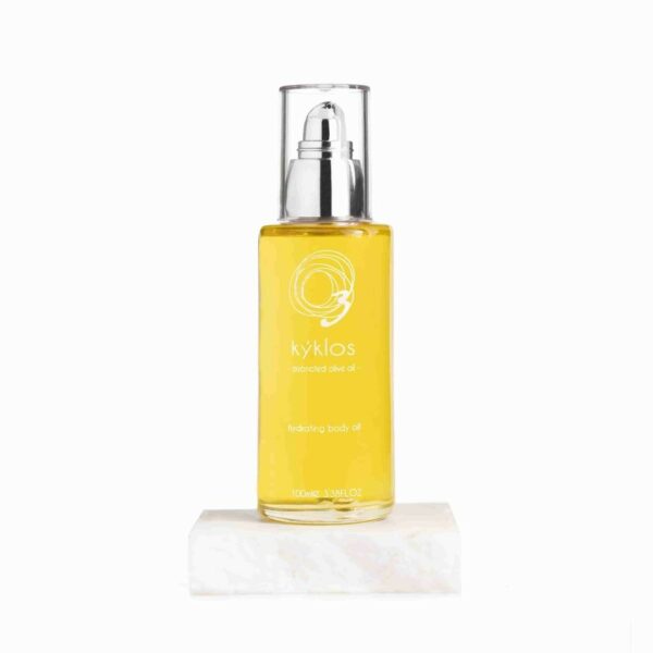 Kyklos hydrating body oil in a clear, sleek glass bottle with a pump dispenser. This luxurious natural cosmetic contains ozonated olive oil for deep hydration, perfect for nourishing bio and organic skincare routines.