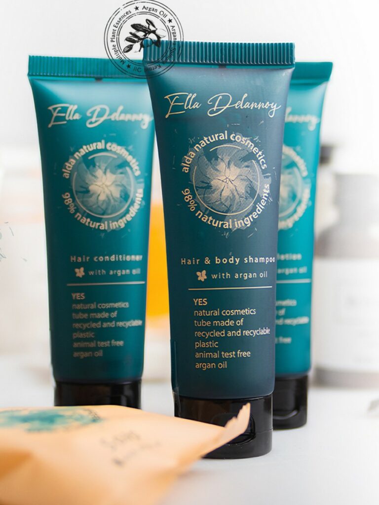 Three sleek green tubes of Ella Delannoy natural hotel toiletries, formulated with argan oil, and Eco pure. A premium part of the ELLA DELANNOY hotel toiletries collection, natural, vegan and indulgent hotel amenities.