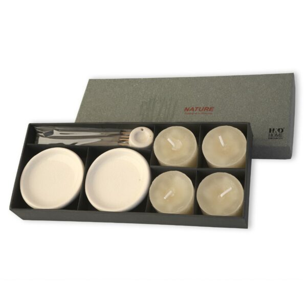 Nature inspired aromatic candles gift set with four ivory-colored candles, ceramic candle plates, and minimalist candlesticks for a serene decor style.