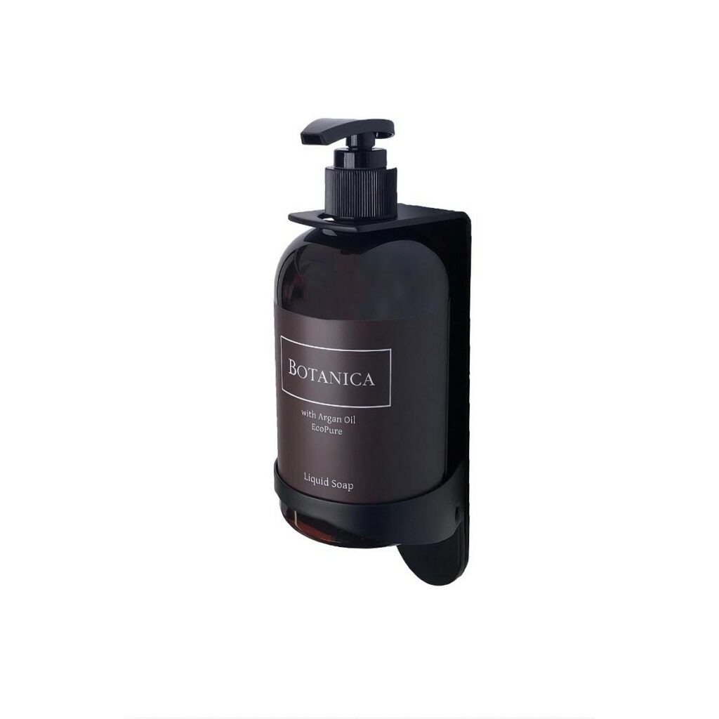 Botanica liquid soap bottle in a sleek black dispenser, featuring argan oil for luxury hotel cosmetics and guest toiletries, mounted on a modern black wall holder, perfect for enhancing hotel amenities.