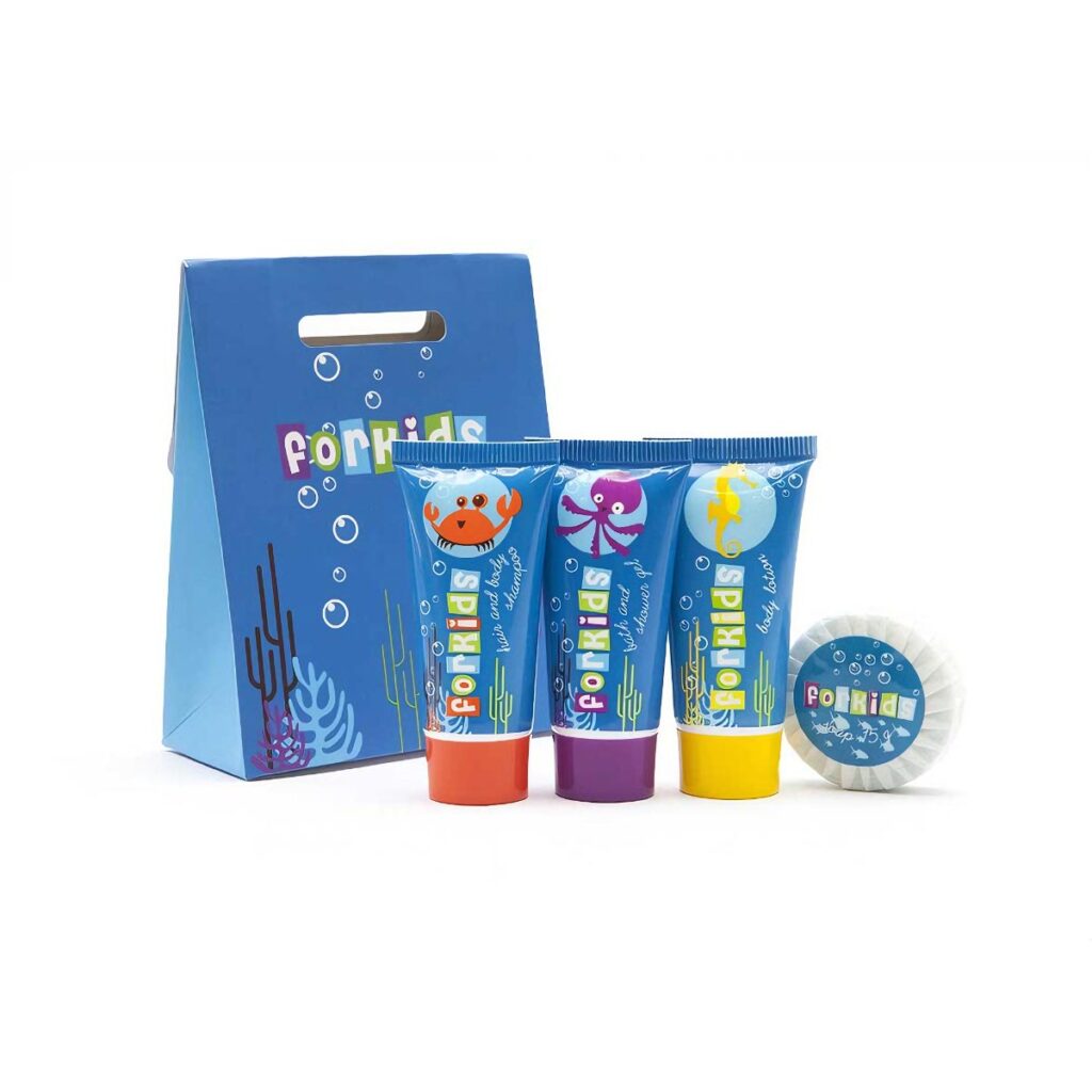 Luxury hotel toiletries set for kids featuring ocean themed packaging, including shampoo, body wash shower gel, body lotion, and soap. Perfect guest toiletries for family-friendly hotels.